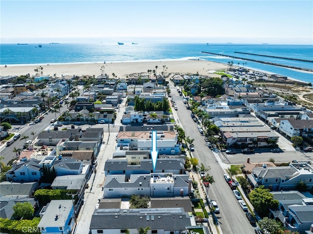 drone / aerial view with a view of the beach and a water view