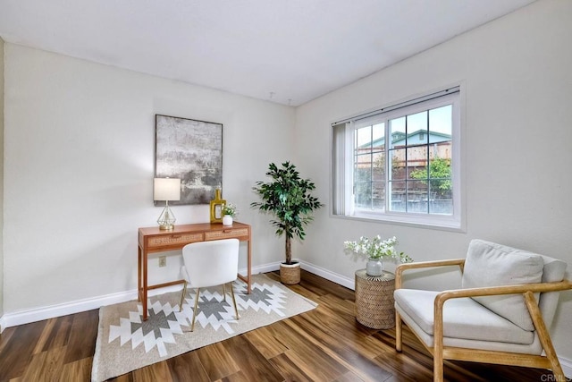 home office with wood finished floors and baseboards