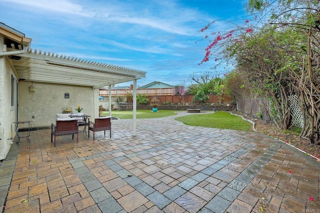 view of patio featuring outdoor dining space, a fenced backyard, and a pergola