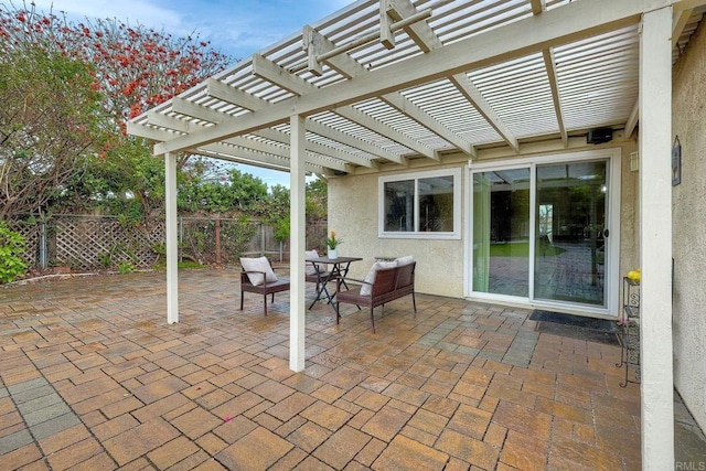 view of patio / terrace with outdoor dining space and fence