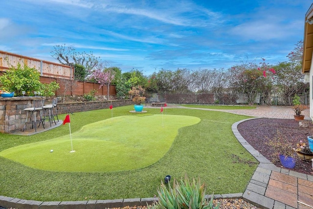 exterior space with a patio and a fenced backyard