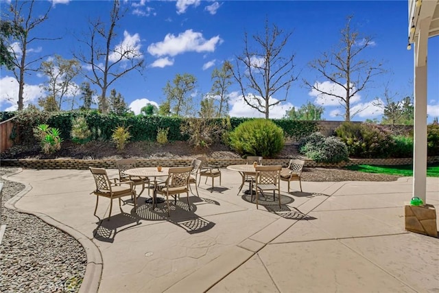 view of patio / terrace with outdoor dining space and fence