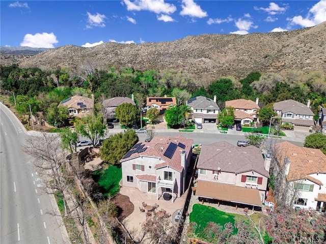 bird's eye view with a residential view and a mountain view