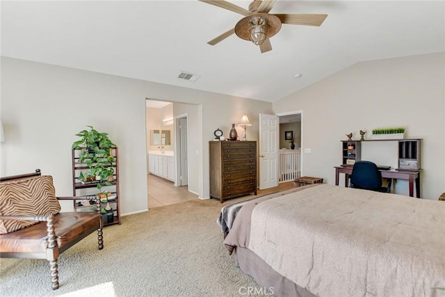 bedroom featuring visible vents, light carpet, lofted ceiling, and connected bathroom