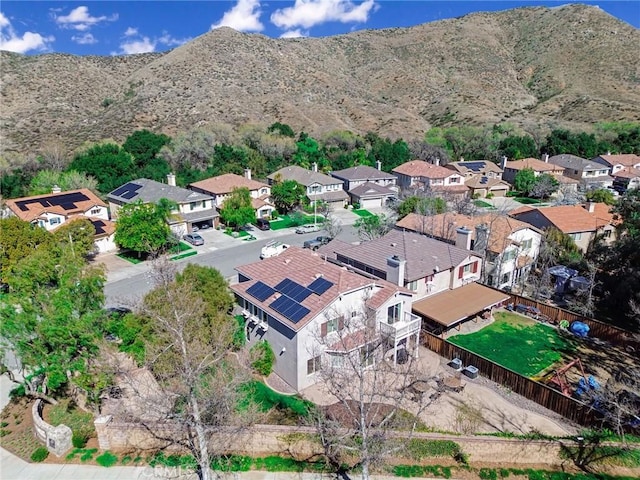 birds eye view of property with a mountain view and a residential view