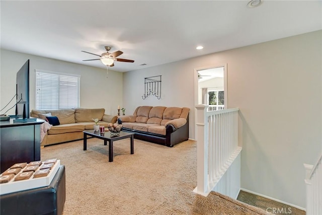 carpeted living area featuring recessed lighting, a healthy amount of sunlight, visible vents, and ceiling fan