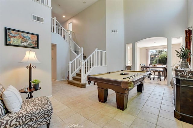 recreation room with light tile patterned floors, visible vents, arched walkways, and pool table