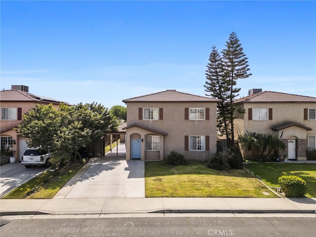 view of front of property with stucco siding, fence, concrete driveway, a front yard, and a tiled roof