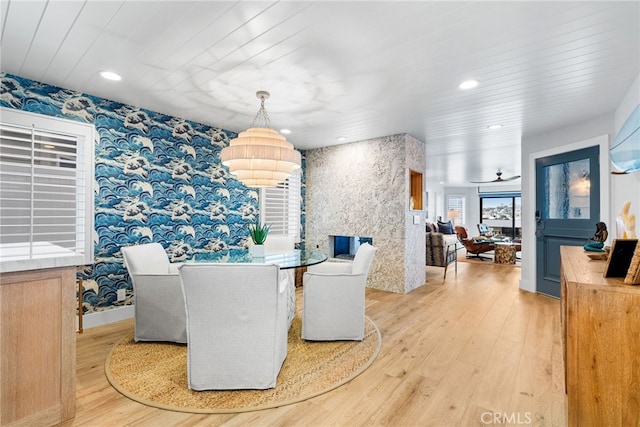 dining room featuring recessed lighting, light wood finished floors, and wallpapered walls