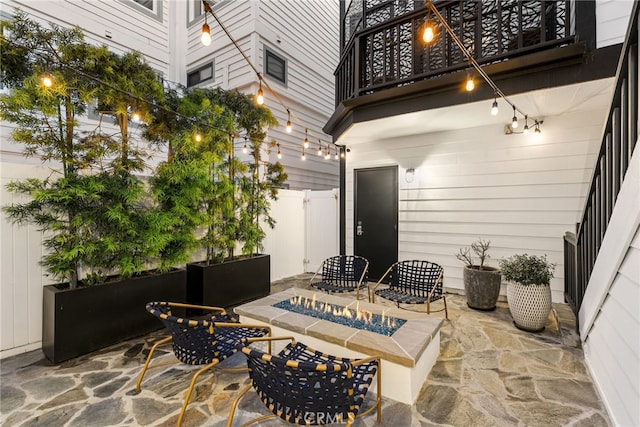 view of patio with fence and an outdoor fire pit