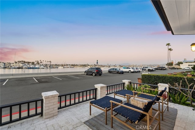 view of patio featuring a water view