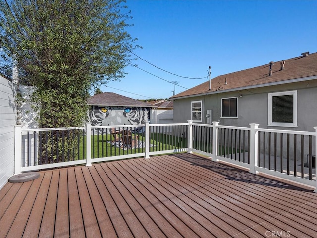 deck featuring an outdoor structure