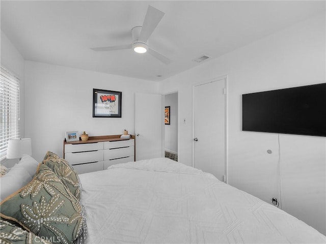 bedroom featuring visible vents and ceiling fan