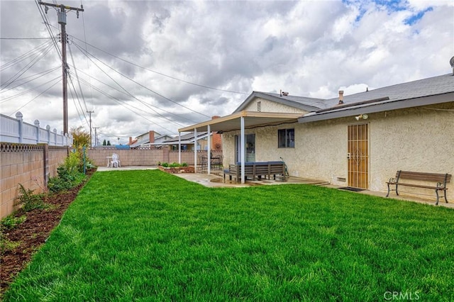 view of yard featuring a patio and a fenced backyard