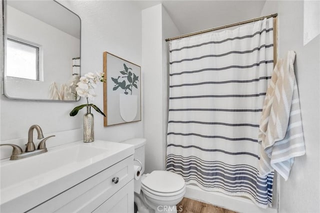 full bath featuring curtained shower, toilet, vanity, and wood finished floors