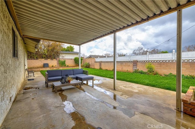 view of patio with outdoor lounge area and a fenced backyard