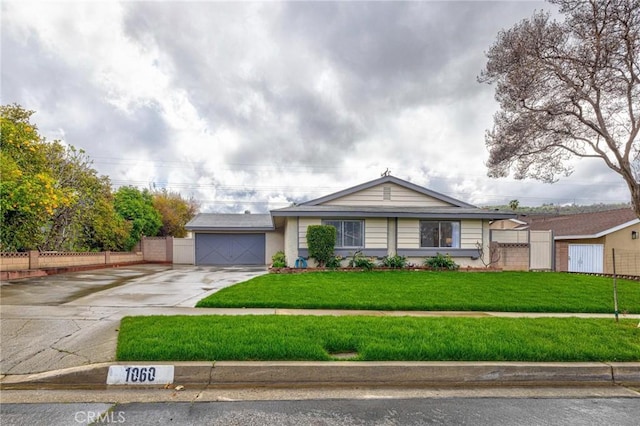 ranch-style home featuring a garage, concrete driveway, a front lawn, and fence