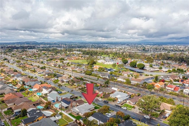 birds eye view of property with a residential view