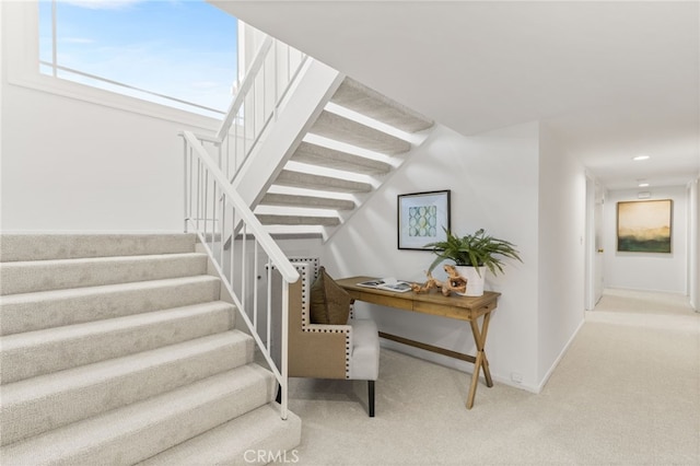 staircase with recessed lighting, baseboards, and carpet floors