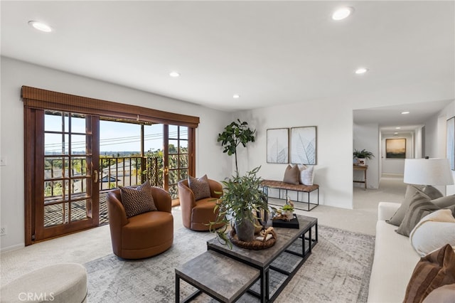 living room with light carpet and recessed lighting