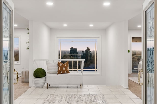 interior space featuring tile patterned floors, recessed lighting, and carpet floors