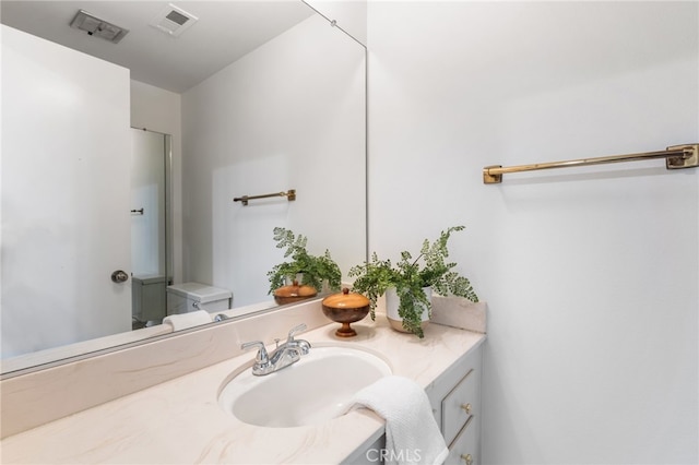 bathroom featuring visible vents and vanity