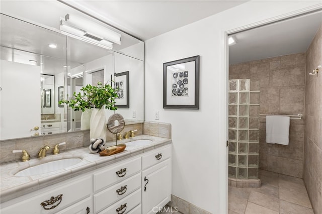 full bath featuring a sink, walk in shower, and double vanity