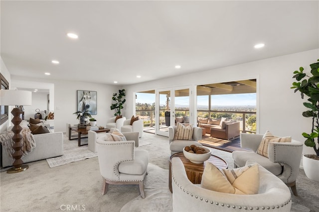 living room with recessed lighting and light colored carpet