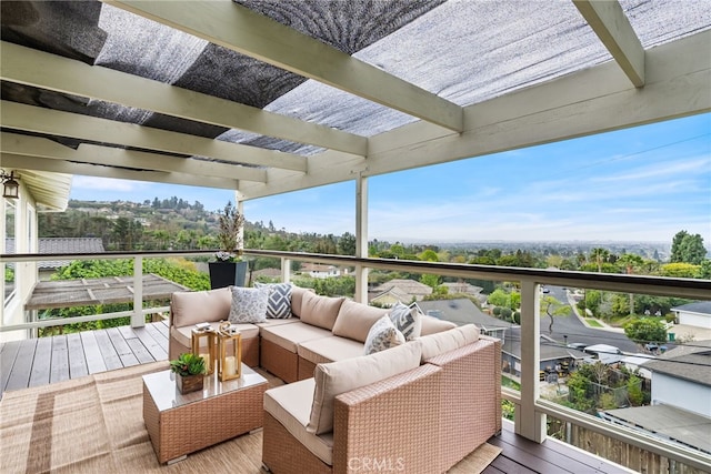 view of wooden balcony with a deck and an outdoor living space