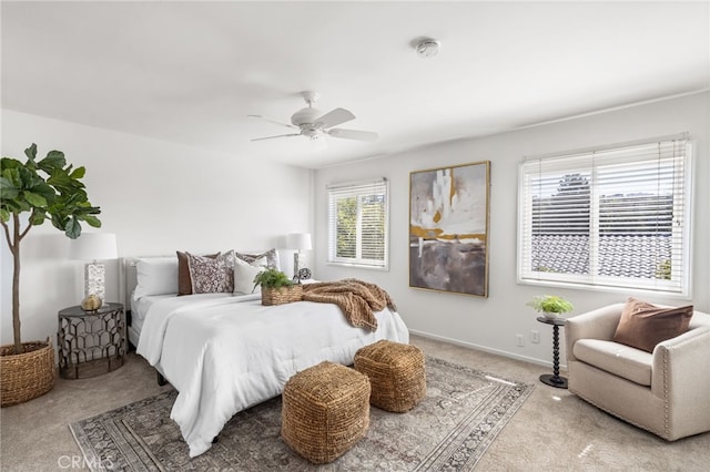 bedroom featuring baseboards, ceiling fan, and carpet floors