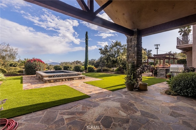 view of patio with a grill and exterior kitchen