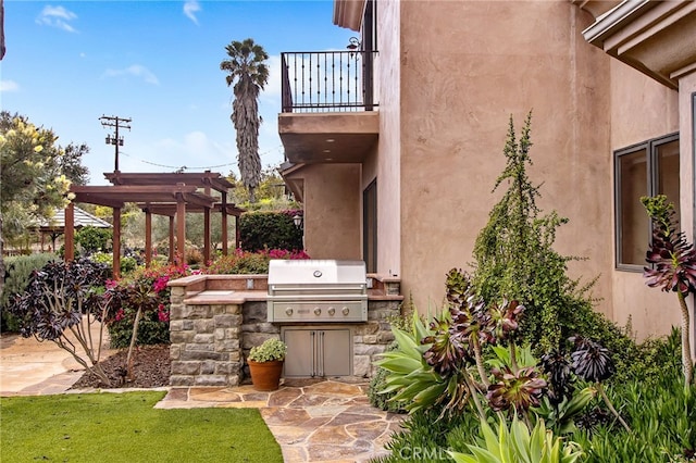 view of patio / terrace featuring a balcony, area for grilling, a pergola, and a grill