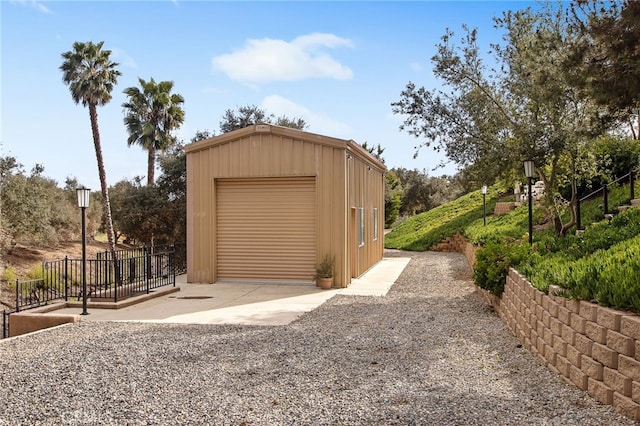 detached garage featuring driveway