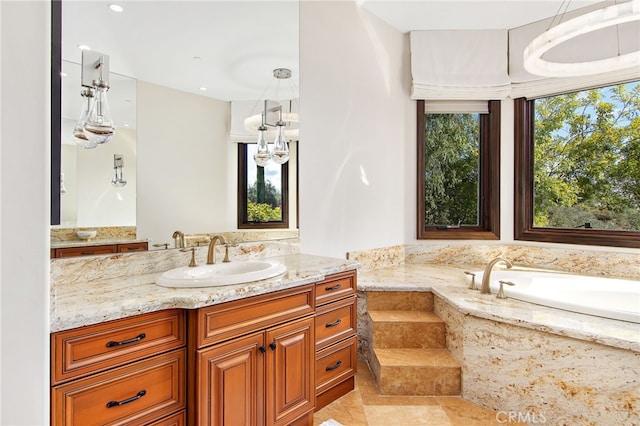 full bathroom featuring vanity and a garden tub