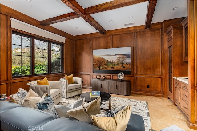 cinema room with beam ceiling, wooden walls, and coffered ceiling