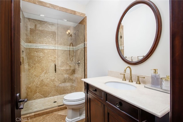 full bath featuring vanity, toilet, and a shower stall