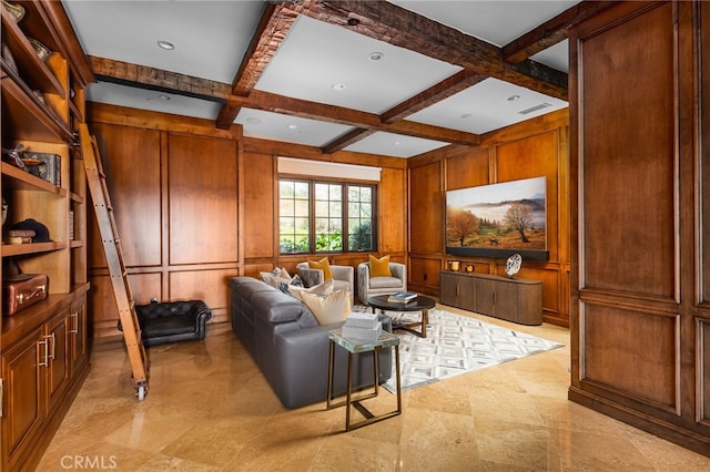 living room with visible vents, beam ceiling, coffered ceiling, wood walls, and a decorative wall