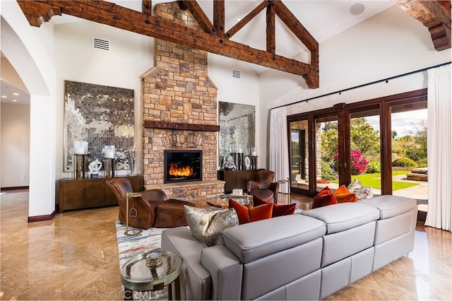 living room with visible vents, high vaulted ceiling, beamed ceiling, and a fireplace