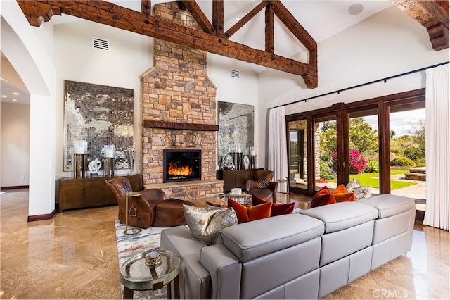 3221 Integrity Way, Fallbrook, CA 92028 - living area with high vaulted ceiling, marble tiled floors, a fireplace, arched walkways, and beamed ceiling