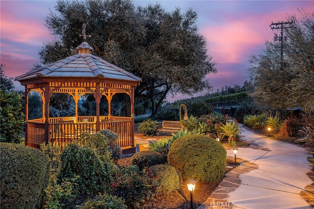 view of home's community with a gazebo and concrete driveway