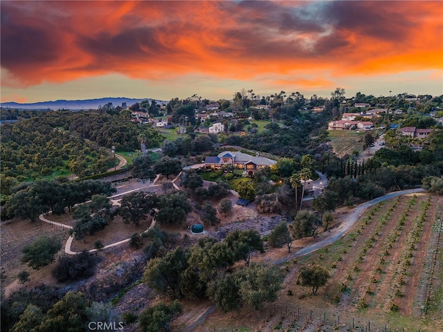 aerial view at dusk with a mountain view