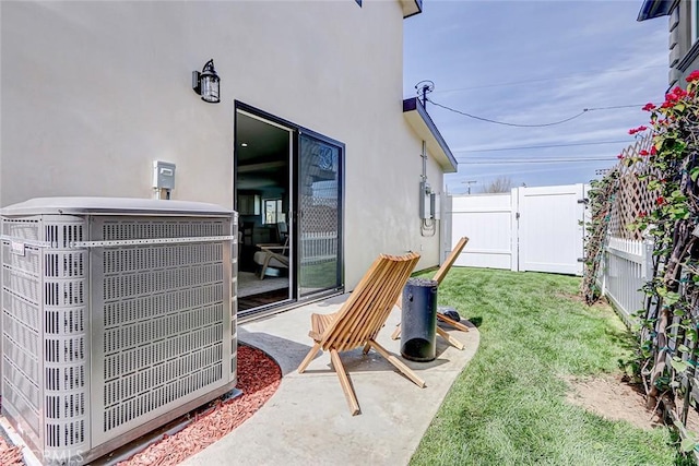 view of patio / terrace featuring central AC and fence