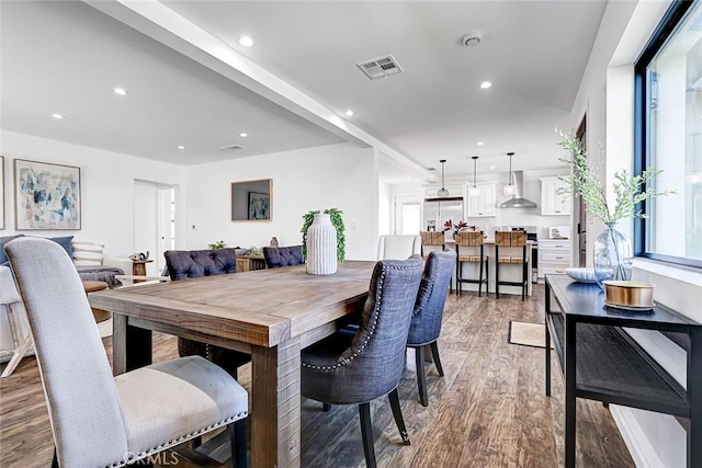 dining space with recessed lighting, light wood-style floors, and visible vents