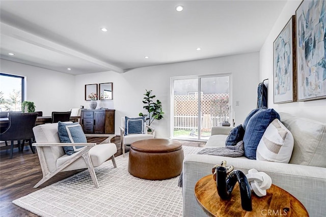 living area featuring beam ceiling, recessed lighting, and wood finished floors