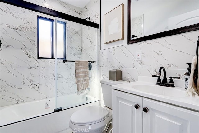 full bath with backsplash, toilet, vanity, combined bath / shower with glass door, and tile walls