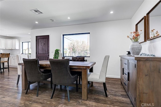 dining space with recessed lighting, visible vents, baseboards, and dark wood-style flooring