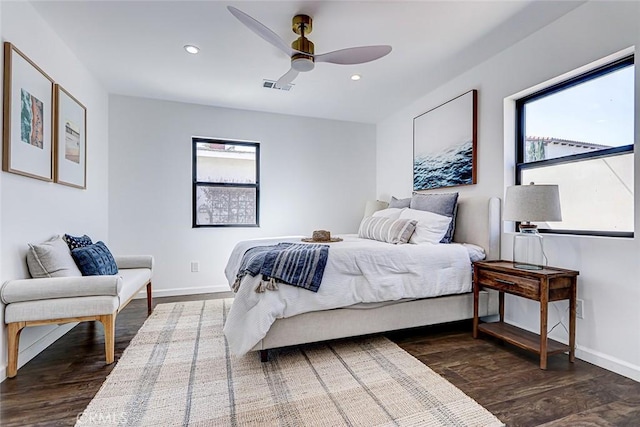 bedroom with a ceiling fan, wood finished floors, visible vents, baseboards, and recessed lighting