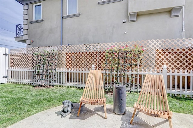 view of patio featuring fence