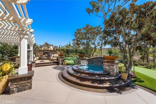 10 Corte Vizcaya, San Clemente, CA 92673 - view of patio with an outdoor stone fireplace and a pergola