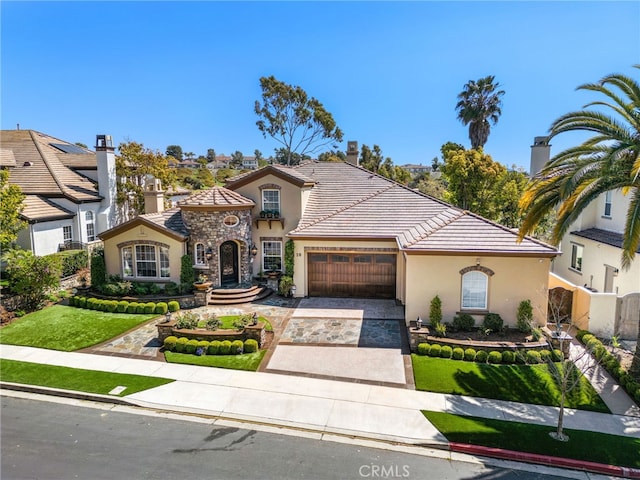 10 Corte Vizcaya, San Clemente, CA 92673 - mediterranean / spanish-style home with stucco siding, concrete driveway, an attached garage, a tile roof, and a front lawn